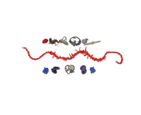 A Bohemian garnet set brooch, designed as a lizard, a white gold and green gem set brooch, two further brooches, a colourless