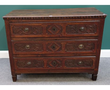 A 19th century French oak commode, with three floral carved long drawers, on tapering square supports, 122cm wide.