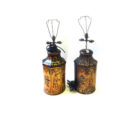 A pair of Regency style gilt tin painted table lamps, decorated with gilt Oriental figures against a black ground, 45cm high,