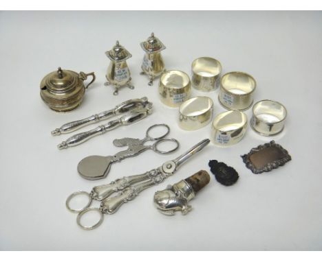 Silver, comprising; a pair of Victorian grape scissors (the hallmark unclear), a pair of pepperettes, Birmingham 1963, a must