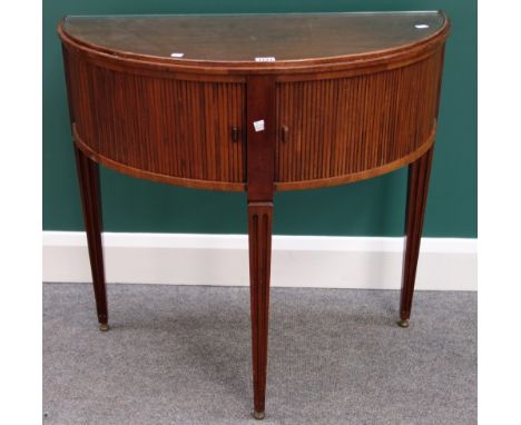 A 19th century Dutch mahogany demi-lune console table, the pair of tambour cupboards on tapering square supports, 80cm wide.