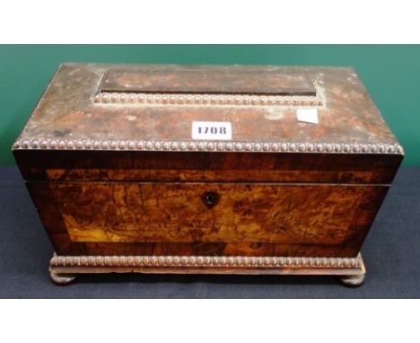A William IV pollard oak and mahogany sarcophagus shaped tea caddy on bun feet, 31cm wide.