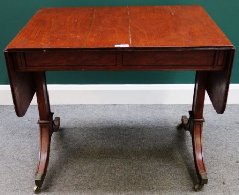 An early 19th century mahogany drop flap sofa table with scumble painted finish, on trestle end supports, 87cm wide.