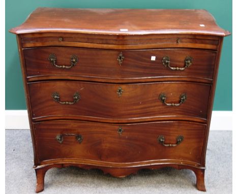 A made-up 19th century mahogany serpentine chest, the brushing slide over three long graduated drawers, on splayed bracket fe