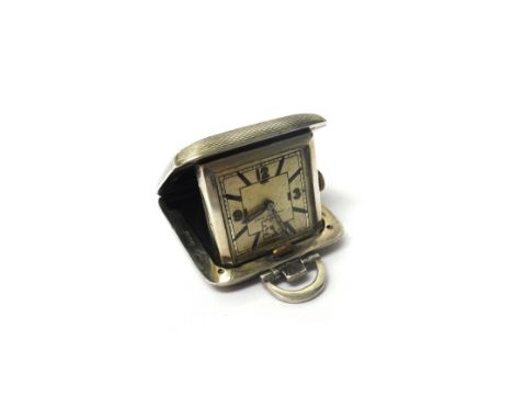 A lady's silver square cased folding travelling watch, the silvered dial with Arabic and baton shaped numerals and detailed D