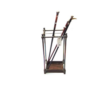 A Victorian tubular brass and cast iron four division stick stand of rectangular form, 62cm high, and three Victorian silver 