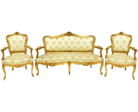 A late 19th century gilt framed Louis XV style five piece salon suite to comprise sofa,153cm wide, and four chairs.   Illustr