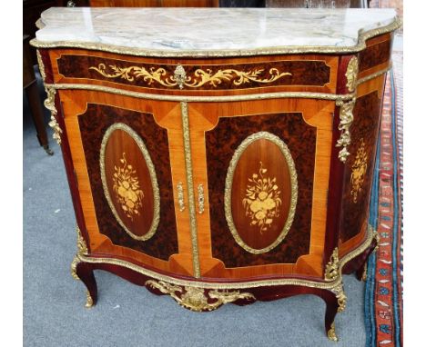 An 18th century style marquetry inlaid gilt metal mounted kingwood and figured walnut commode, the serpentine marble top over