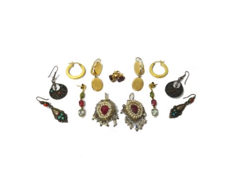 A pair of gold circular earrings, detailed 750, a pair of gold earrings as made from a pair of oval cufflinks engraved with m