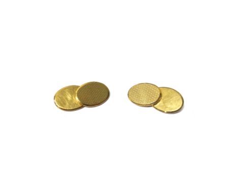 A pair of 9ct gold cufflinks, the oval backs and fronts having engine turned decoration, Birmingham 1968, weight 14.8 gms.