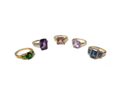 A 9ct gold ring, claw set with a cushion shaped amethyst between diamond set four stone shoulders, two 9ct gold, diamond and 