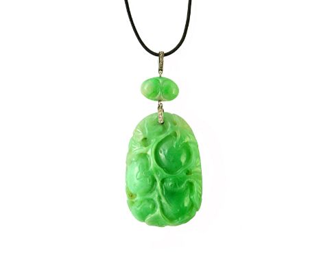 A Chinese carved jade and diamond set pendant, the principal drop carved and pierced with foliage and fruit and with a smalle