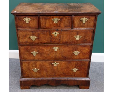 A William and Mary featherbanded walnut chest of three short and three long graduated drawers, on later bracket feet, 81cm wi