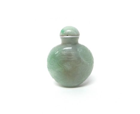 A Chinese jade snuff bottle, 20th century, carved in low relief with bats amongst cloud scrolls, 6.5cm. high.