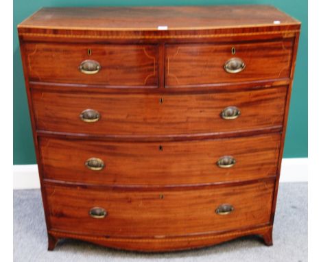 A Victorian inlaid mahogany bowfront chest of two short and three long graduated drawers, on splayed bracket feet, 105cm wide