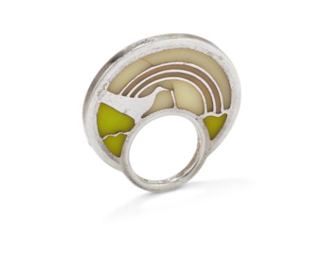 §A ring, by Susanna Heron, 1972&nbsp;The raised silver circle of abstract design with cream and green translucent enamel deco