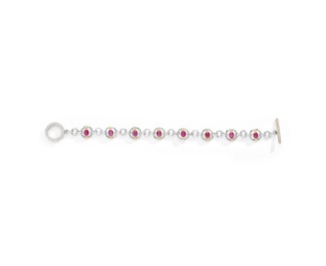 A ruby and diamond bracelet Composed of a series of collet-set oval-cut ruby and brilliant-cut diamond three-stone links in c