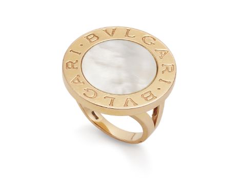 A mother-of-pearl ring, by Bulgari The circular mother-of-pearl plaque within a polished border, engraved 'Bvlgari Bvlgari', 