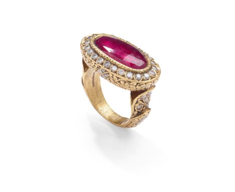 A ruby and diamond dress ring The oval rose-cut ruby in a foiled closed back setting, within a brilliant-cut diamond surround