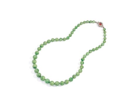 An early 20th century jadeite jade, ruby and diamond necklace, circa 1930 Composed of a single strand of graduated 11.1-6.8mm
