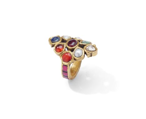 Y An Indian Navaratna gem-set dress ring Designed as an openwork cluster set with nine foiled-back gems, including pearl, cat