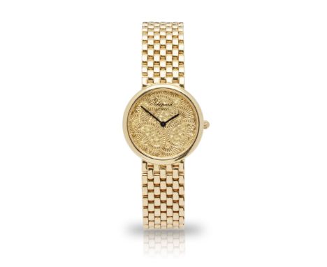 Chopard: a bracelet watch Casmir model, quartz movement, round engraved dial with Paisley or boteh pattern, no numerals, blac