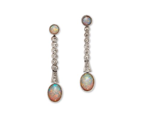 A pair of early 20th century opal and diamond pendent earrings, circa 1900 Each oval cabochon opal, suspended from an old bri