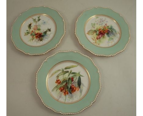 Three Royal Worcester plates, decorated with foliage and flowers to a pale green border by Frank Roberts, diameter 9.5insCond