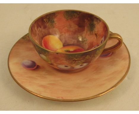 A Royal Worcester miniature cup and saucer, decorated with fruit by RobertsCondition Report:  Good condition