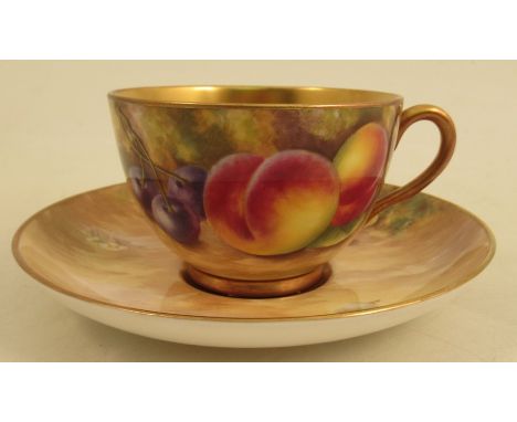 A Royal Worcester cup and saucer, decorated with fruit by MayburyCondition Report:  Good condition