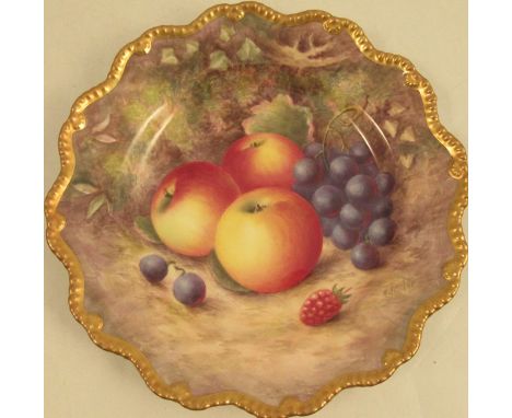 A Royal Worcester plate, decorated with fruit to a shaped gilt border by Ayrton, dated 1952, diameter 8.75insCondition Report