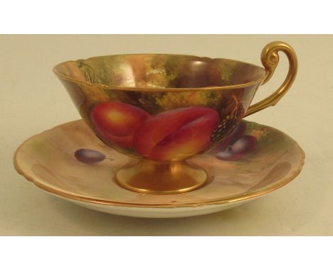 A Royal Worcester cup and saucer, decorated with fruit by Townsend and AyrtonCondition Report:  Crazing to saucer but otherwi