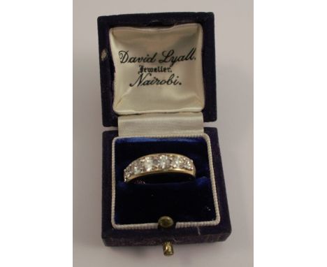 A seven stone diamond and gold ring, set in 18ct gold, marked 1.5 (carats)