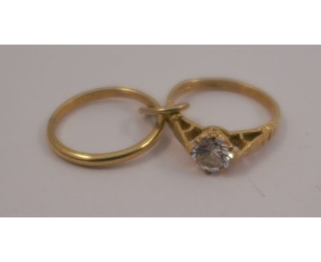A 9ct gold wedding ring and engagement ring charm, 1.9g gross