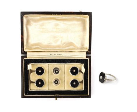 A CASED SET OF 9CT. WHITE GOLD AND BLACK ENAMEL GENTLEMEN'S CUFF LINKS AND PAIR OF DRESS STUDS each with bright cut borders a