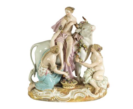 A 19TH CENTURY MEISSEN FIGURE GROUP OF A BULL WITH A SEATED LADY RIDER AND A FLOWER SELLER finely modelled and coloured with 