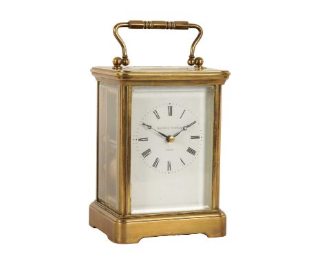 A MATTHEW NORMAN BRASS STRIKING CARRIAGE CLOCK the white enamel Roman dial fronting a spring driven eight day movement with l