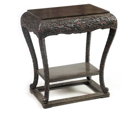 A LATE 19TH CENTURY CHINESE RED GROUND AND BLACK LACQUERWORK CENTRE TABLE the plain top on a rounded frieze carved with flyin