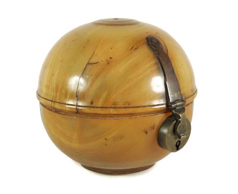 AN UNUSUAL GEORGE III HORN GLOBULAR TEA CADDY with pinned metal mounts and strapped hinge, with fitted lock to the front11cm 