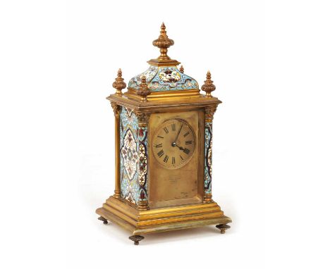 A LATE 19TH CENTURY FRENCH GILT BRASS AND CHAMPLEVE ENAMEL CARRIAGE STYLE MANTEL CLOCK the caddy style enamel top with five l