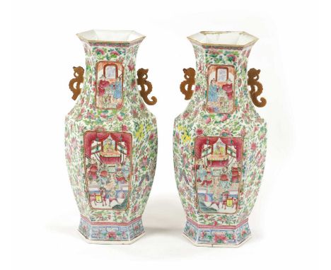 A LARGE PAIR OF 19TH CENTURY CHINESE CANTON FAMILLE ROSE VASES the tapered hexagonal panelled bodies with flared necks and gi