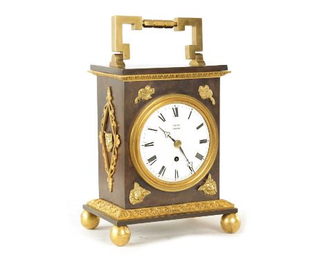 DECAIX, LONDON. AN EARLY 19TH CENTURY BRONZE & ORMOLU TABLE CLOCK the case with brass hinged handle above a rectangular patin