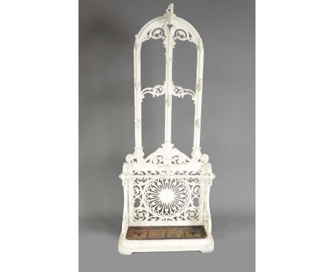 A 19TH CENTURY CAST IRON COALBROOKDALE HALL STAND with arched leaf cast frame above a floral star base with lift out tray and