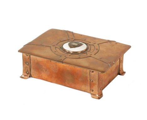 AN ART NOUVEAU A.E.JONES COPPER AND ENAMEL LIDDED BOX having strap rivet work design and centred by an enamel coat of arms fo