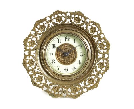 A LATE 19TH CENTURY BRASS FRAMED STRUT CLOCK the pierced floral frame enclosing an enamel Arabic dial with pierced brass cent