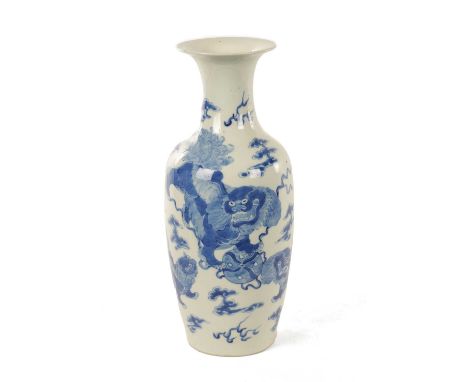 A 19TH CENTURY CHINESE BLUE AND WHITE PORCELAIN OVOID VASE of shouldered form with flared neck, decorated with foo dogs and c