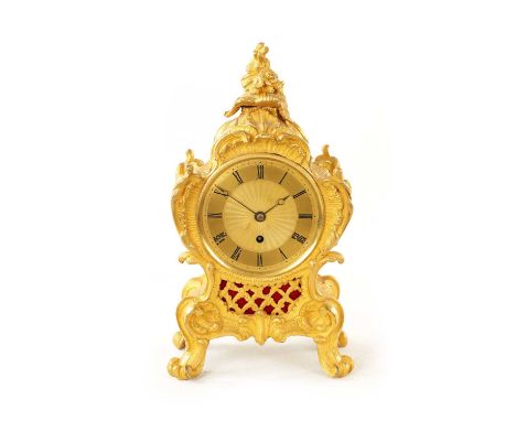 GANTHONY, CHEAPSIDE. AN ENGLISH REGENCY ORMOLU FUSEE MANTEL CLOCK the rococo style case of scrolling leaf work design and sil