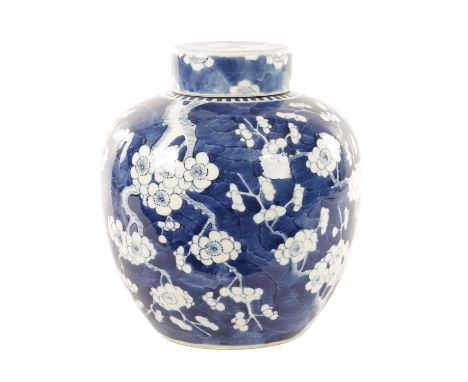 A 19TH CENTURY CHINESE BLUE AND WHITE PRUNUS HAWTHORN PATTERN GINGER JAR AND COVER of bulbous rounded form fitted a lift off 