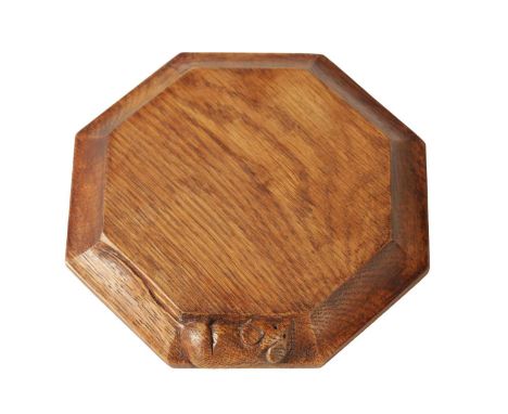 A ROBERT 'MOUSEMAN' THOMPSON OCTAGONAL OAK CHEESE BOARD with moulded panelled border and flattened carved mouse trademark.19c