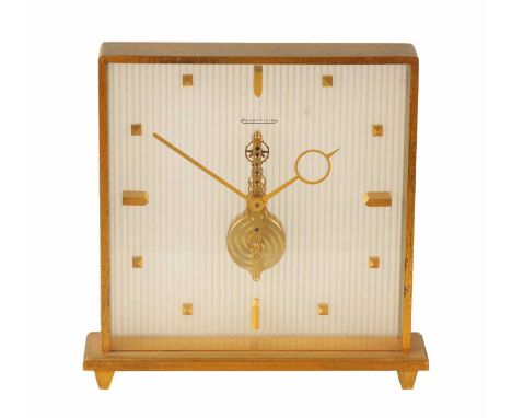 A MID 20TH CENTURY JAEGER-LECOULTRE MANTEL CLOCK the square gilt brass glazed case enclosing a corrugated dial with gilt mark